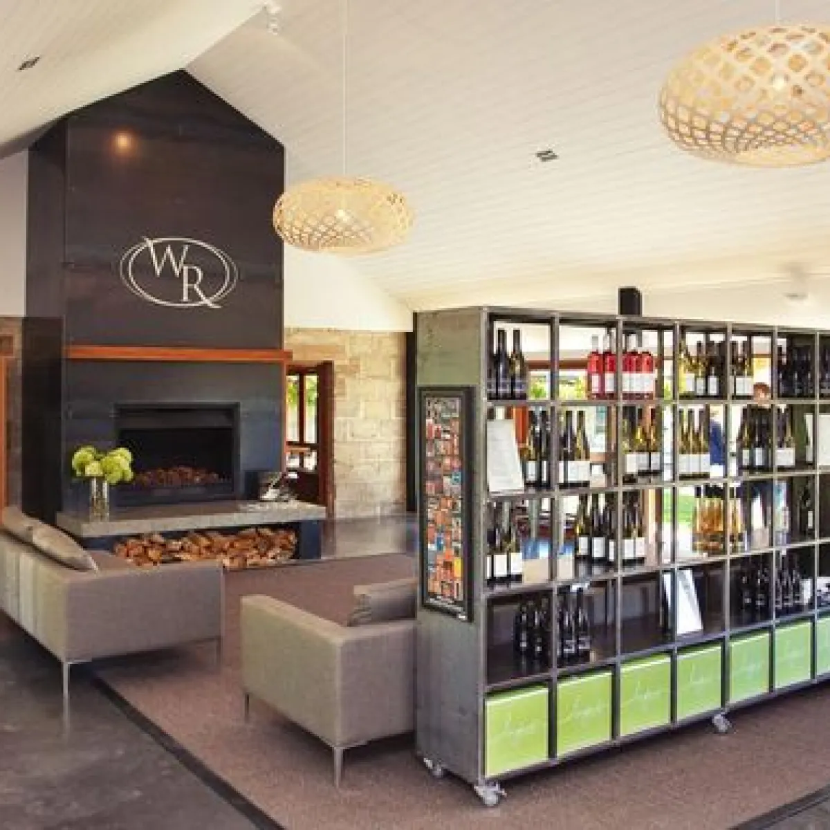 a living room filled with furniture and a fireplace