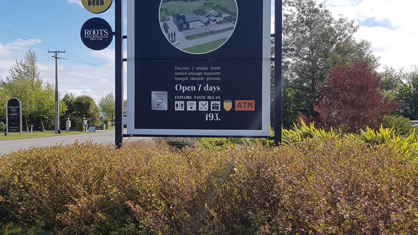 a sign on the side of the street